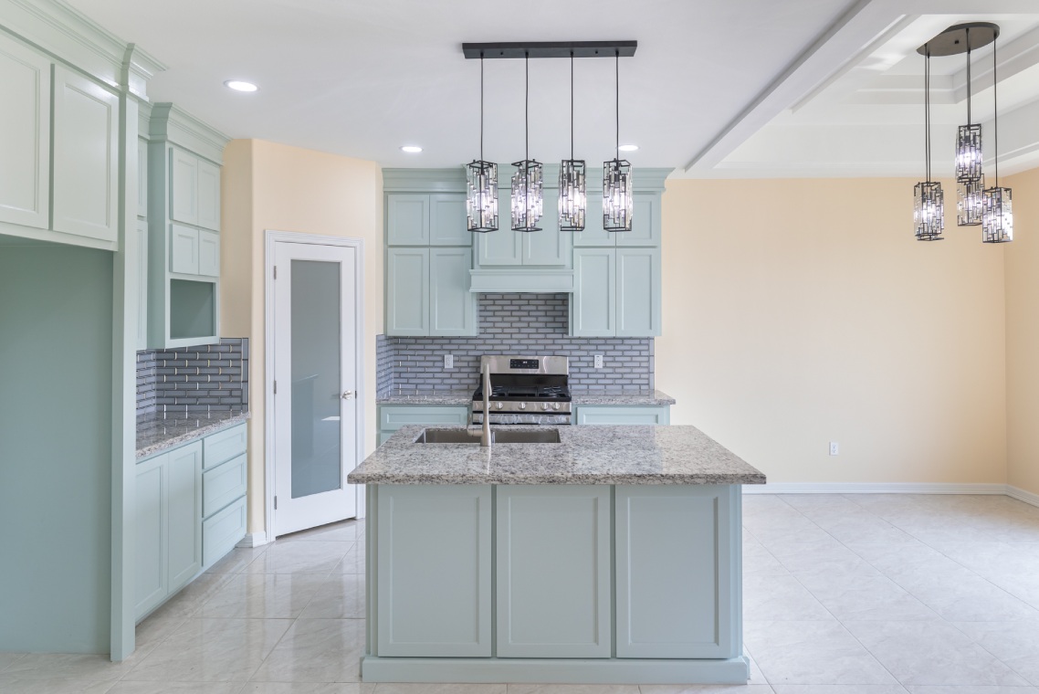 Kitchen with center island and stovetop oven