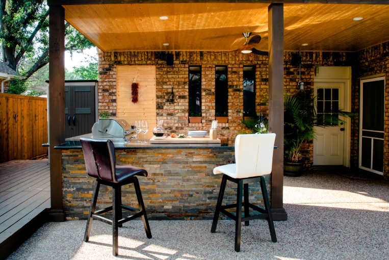 New and modern outdoor kitchen on a sunny summer evening, dinner preparation