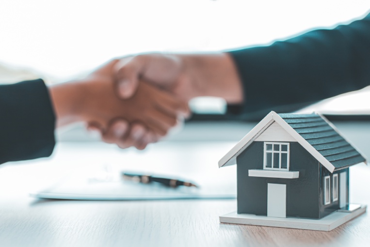 Business success, Real estate agents and customers shake hands to congratulate after signing a contract to buy a house with land and insurance, handshake and Good response concept.