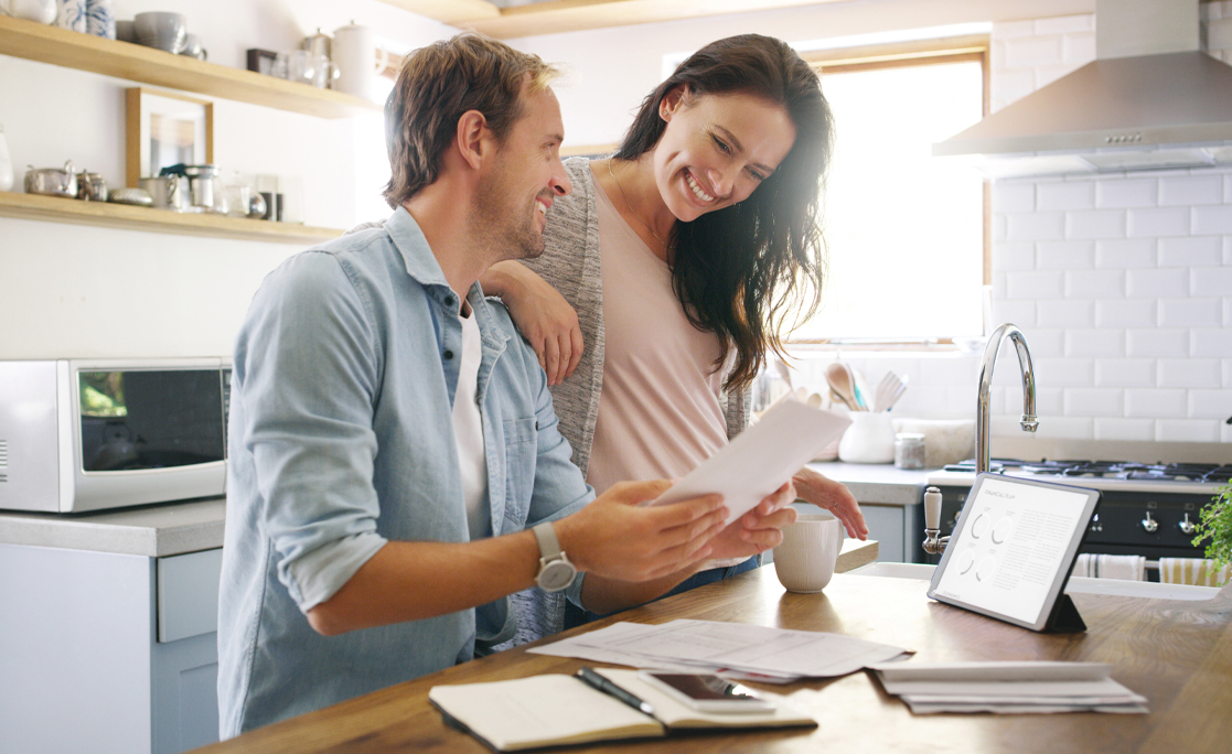 Couple, happy and tablet with documents at house for financial planning, bank balance and debt payment. Man, woman and paperwork for budget savings, property insurance and credit score of mortgage